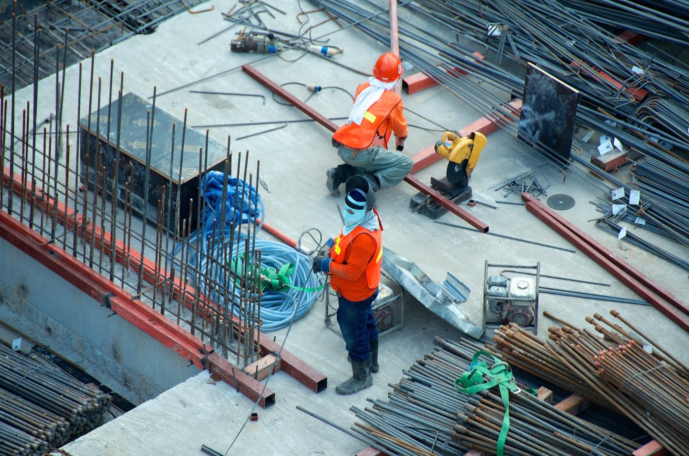 Trade crew working steel on a job site