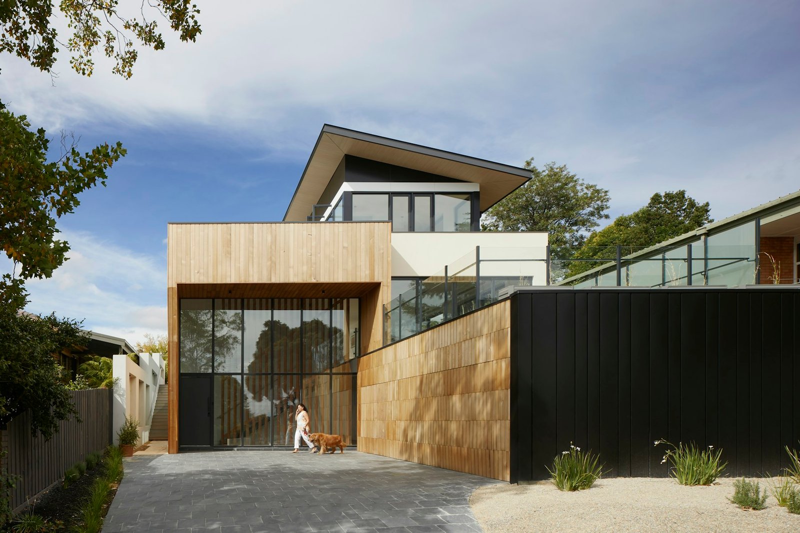 Modern house with a solid vertical metal privacy wall